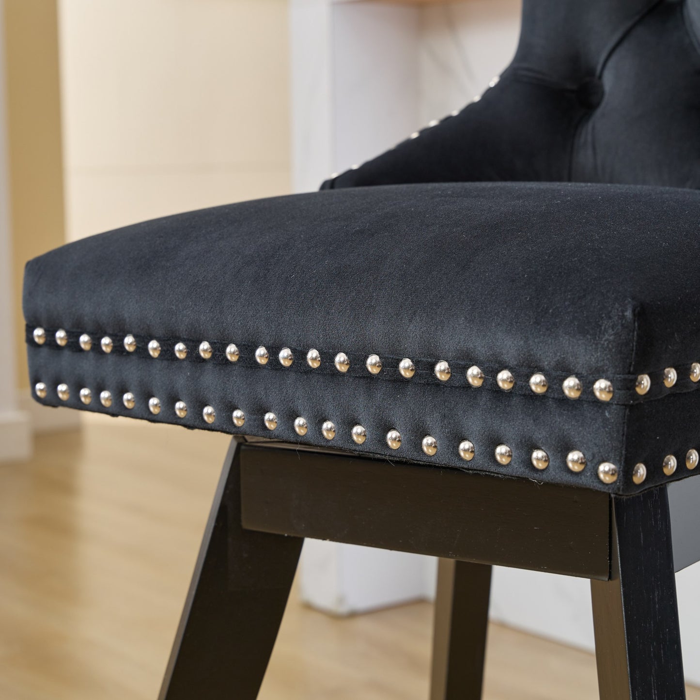 Black velvet bar stool with silver stud trim