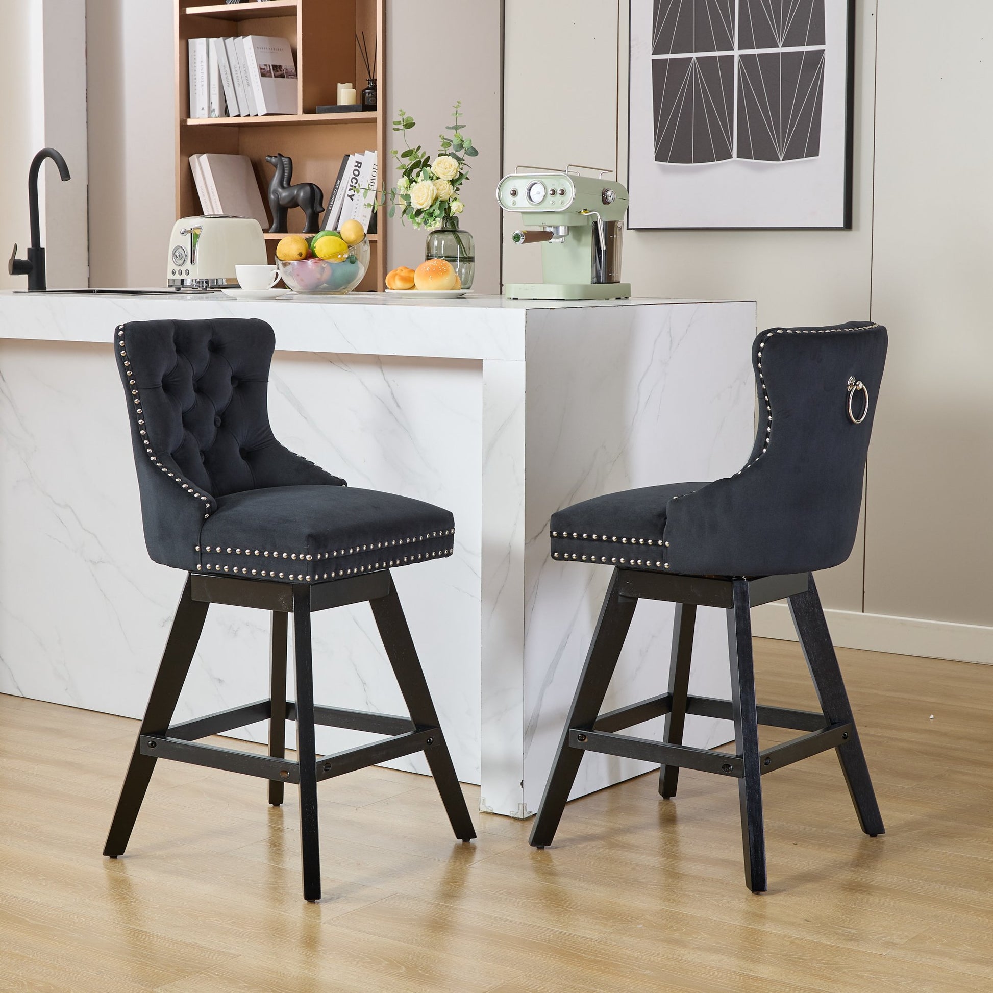 Black velvet tufted bar stool with silver nailhead trim and chrome ring