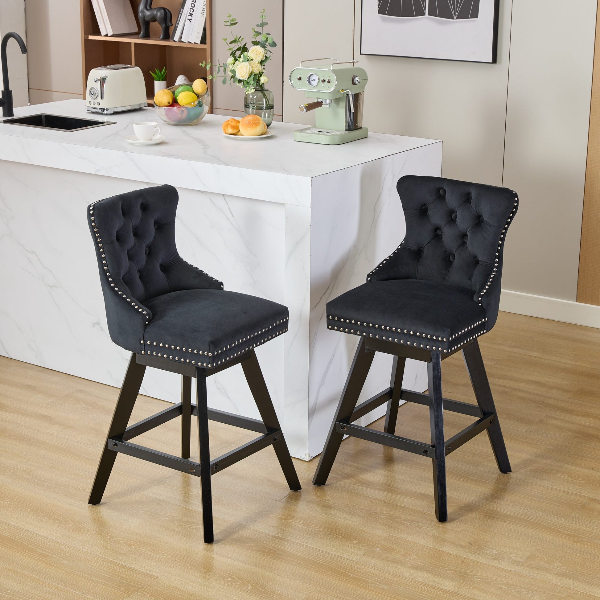 Black velvet tufted bar stool with silver nailhead trim and wooden legs