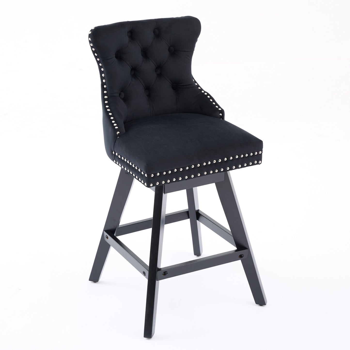 Black velvet tufted bar stool with silver nailhead trim and dark wood legs