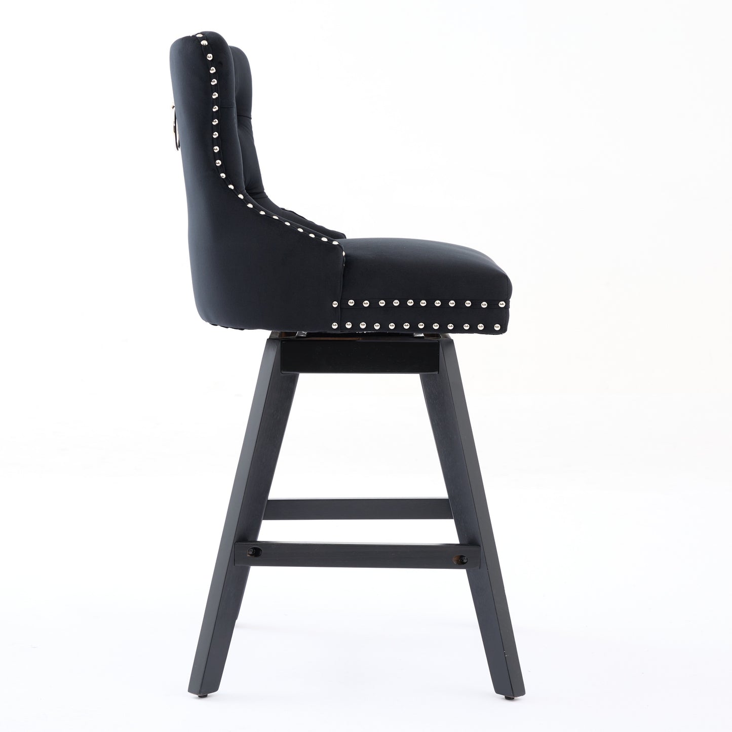 Black velvet tufted bar stool with silver nailhead trim and dark wood base