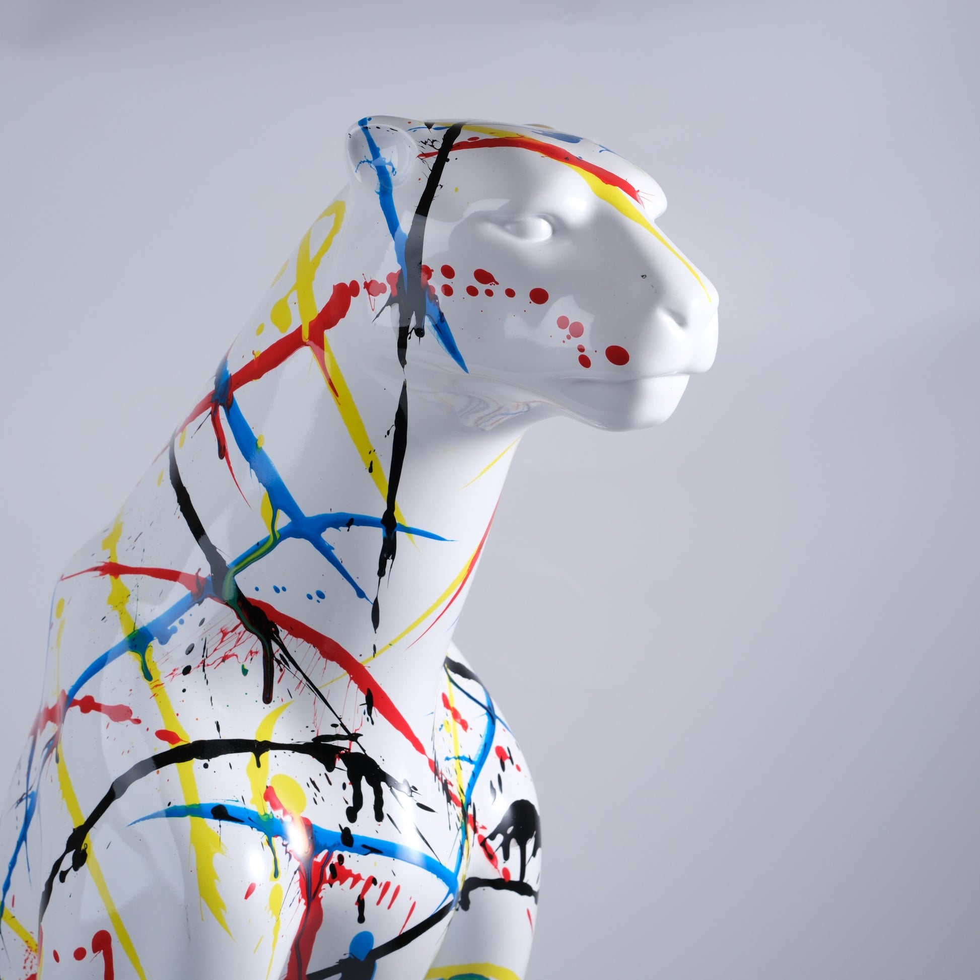 Abstract art panther sculpture with vibrant paint splatters