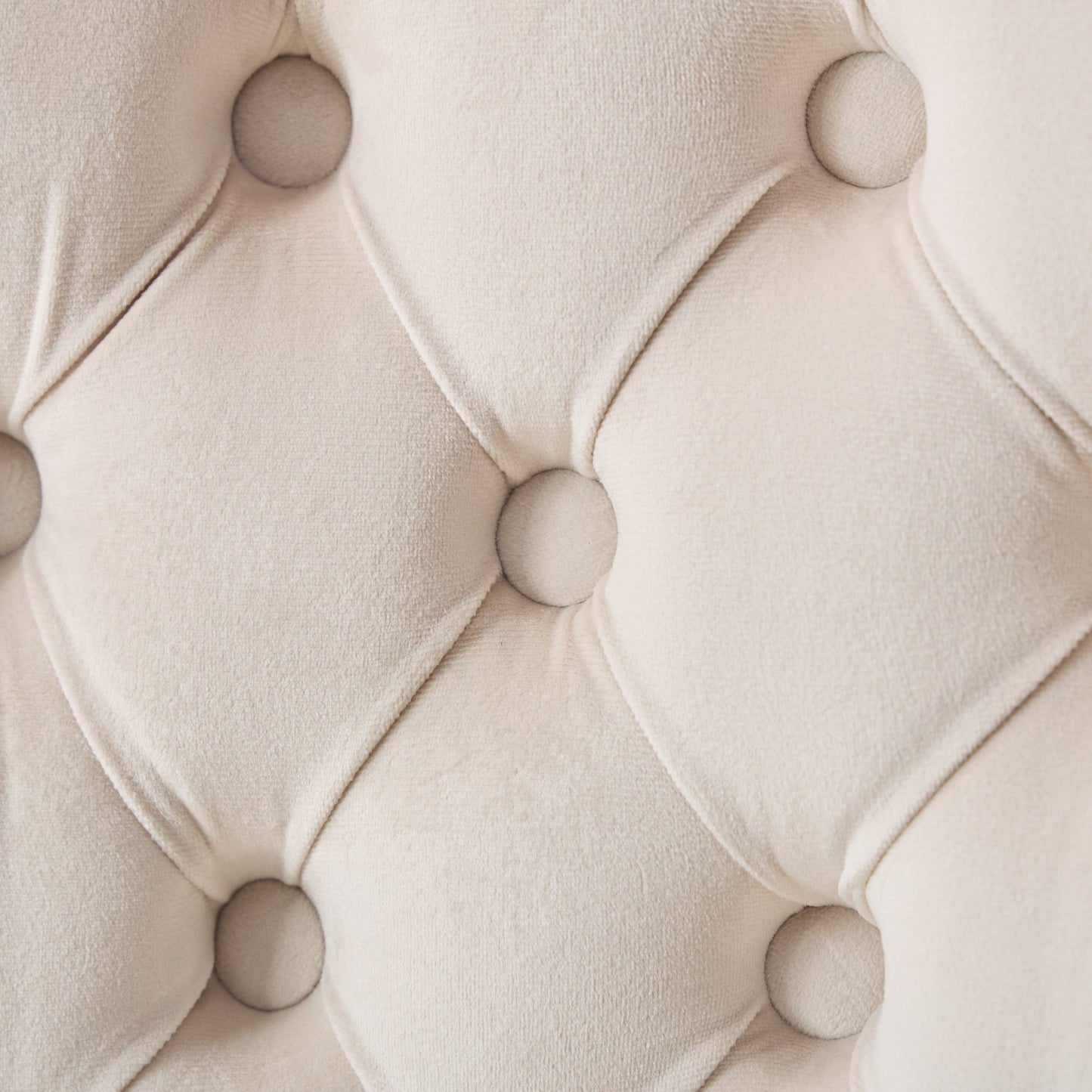 Cream velvet tufted fabric closeup