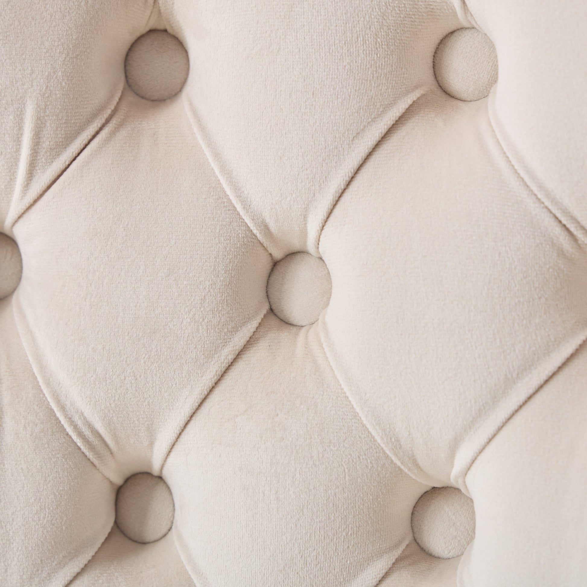 Cream velvet tufted fabric closeup