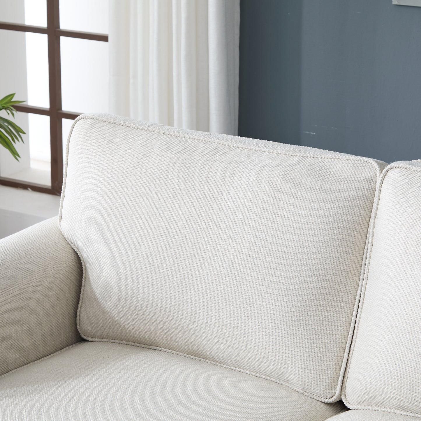 Close up of a textured cream fabric sofa cushion