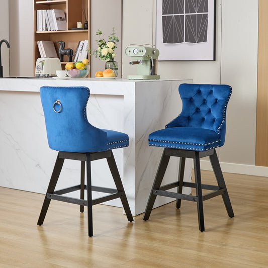 Deep blue velvet bar stool with tufted back and silver nailhead trim
