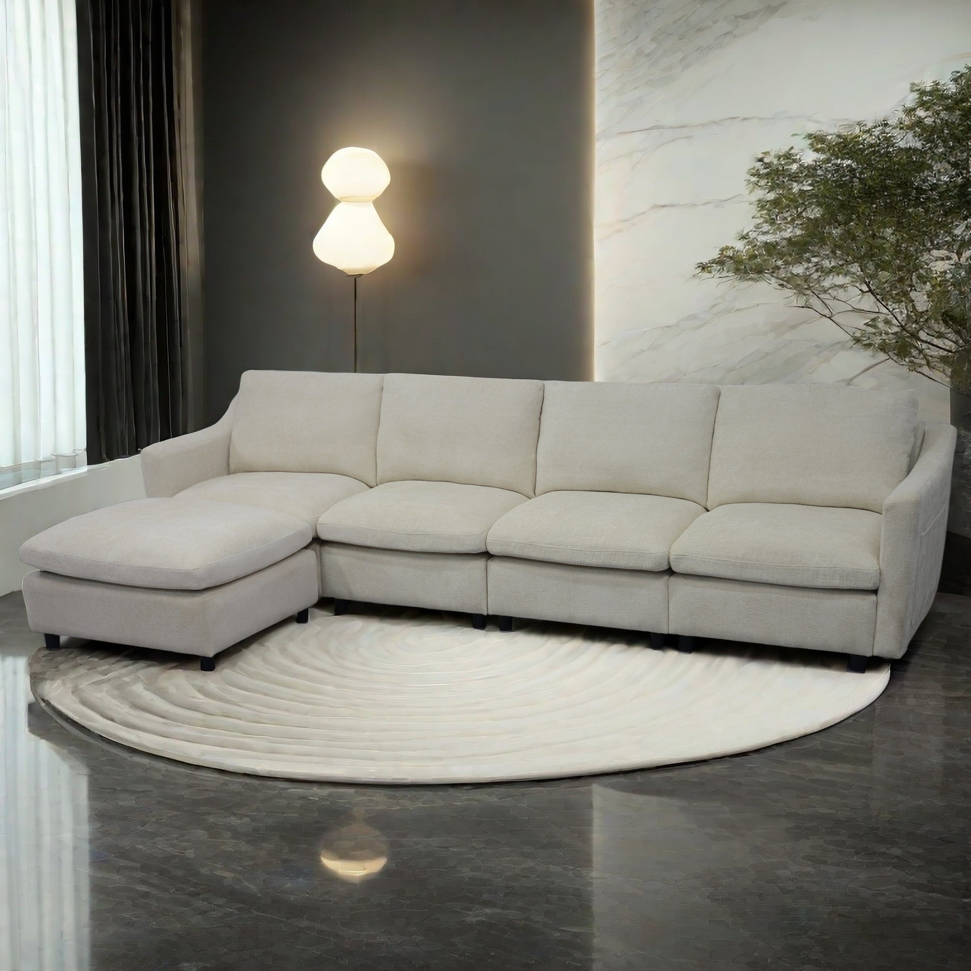 Lshaped beige fabric sectional sofa with chaise lounge on round rug