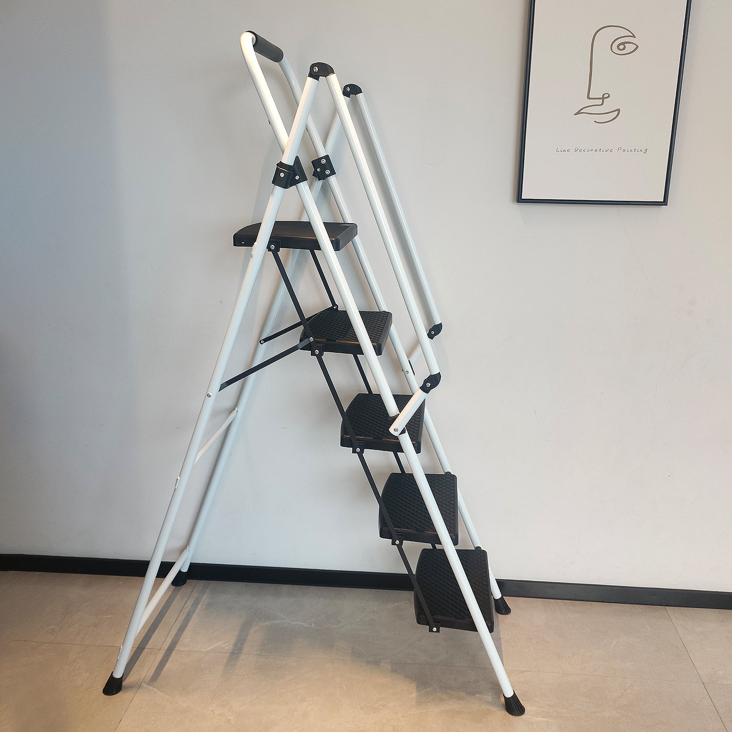White step folding step ladder with black treads