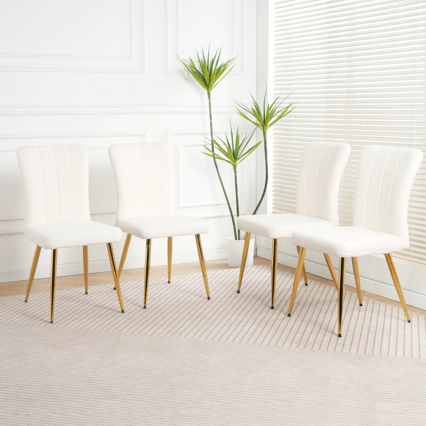 Cream boucle dining chair with gold legs