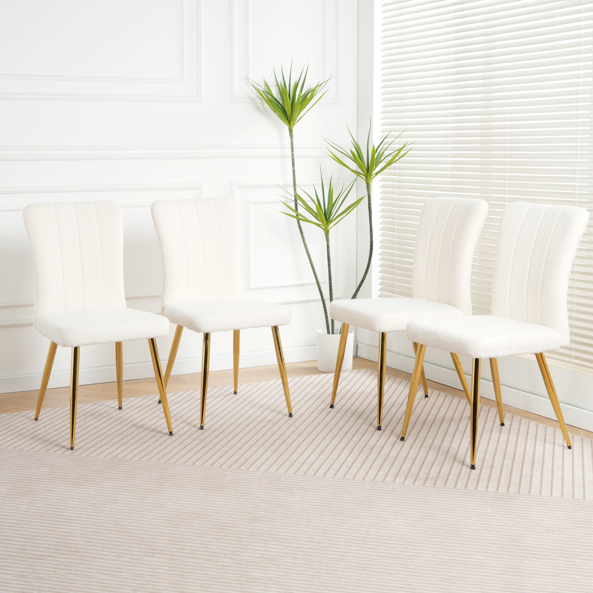 Cream boucle dining chair with gold legs