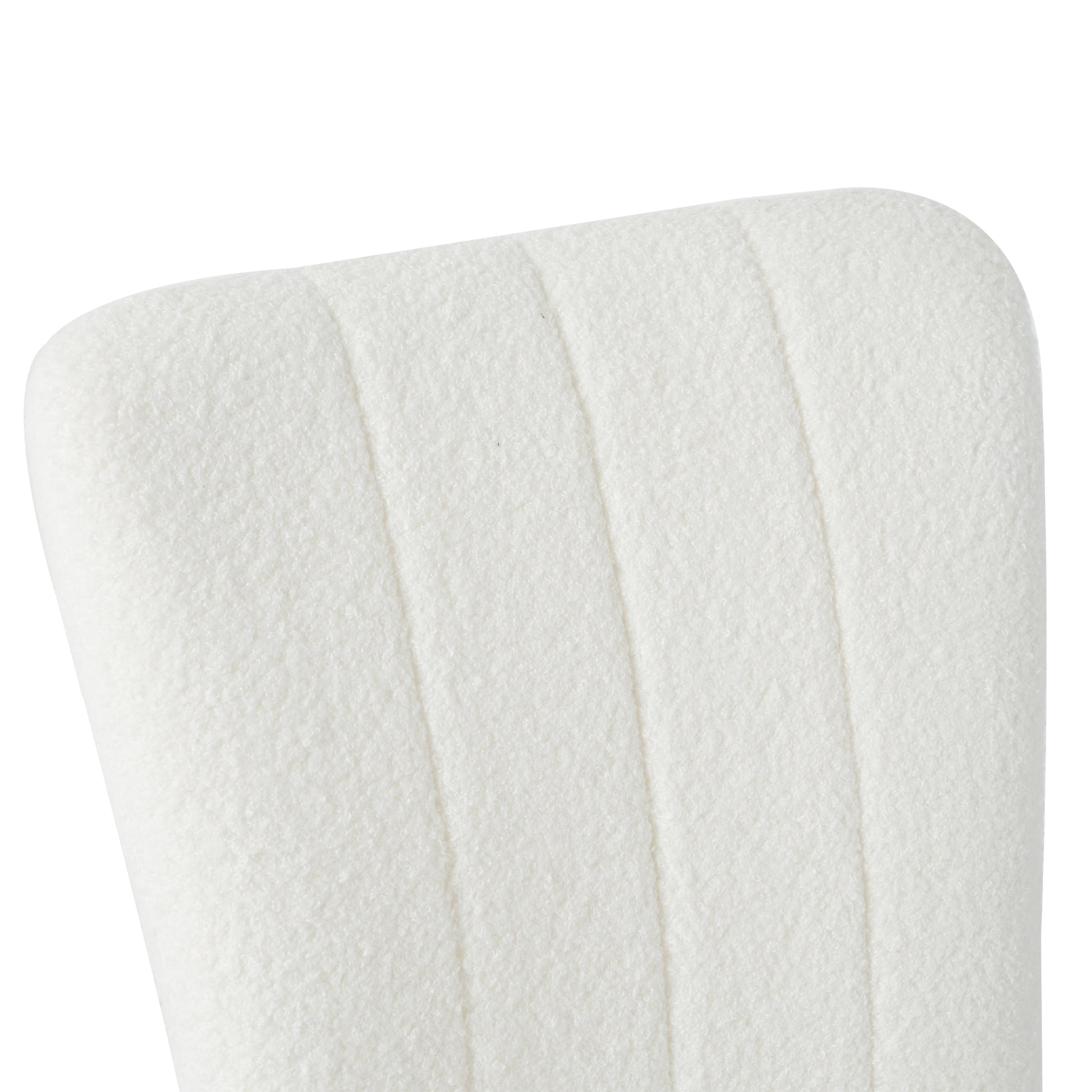 Cream boucle upholstered chair back with vertical stitching detail
