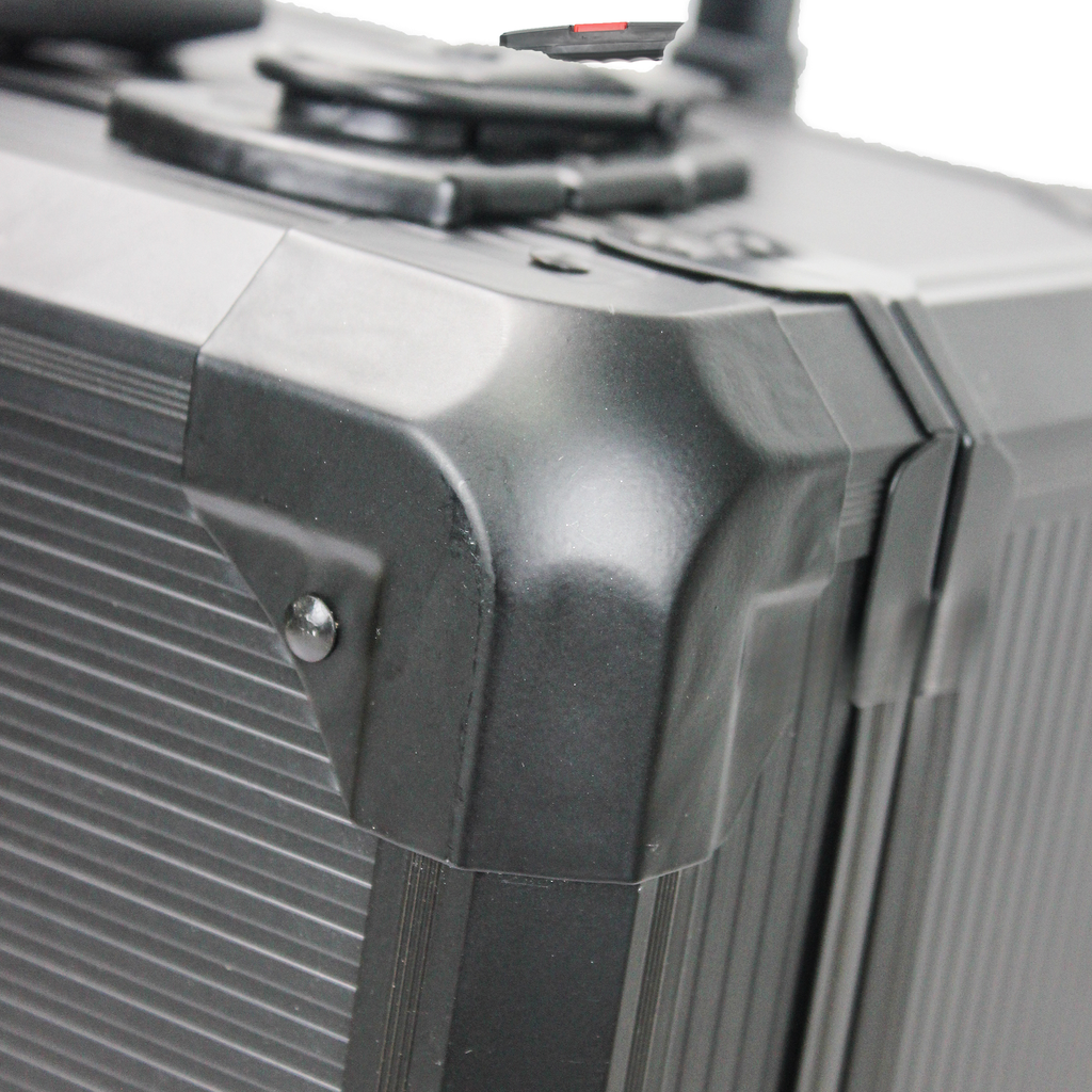 Black aluminum case corner with ribbed texture