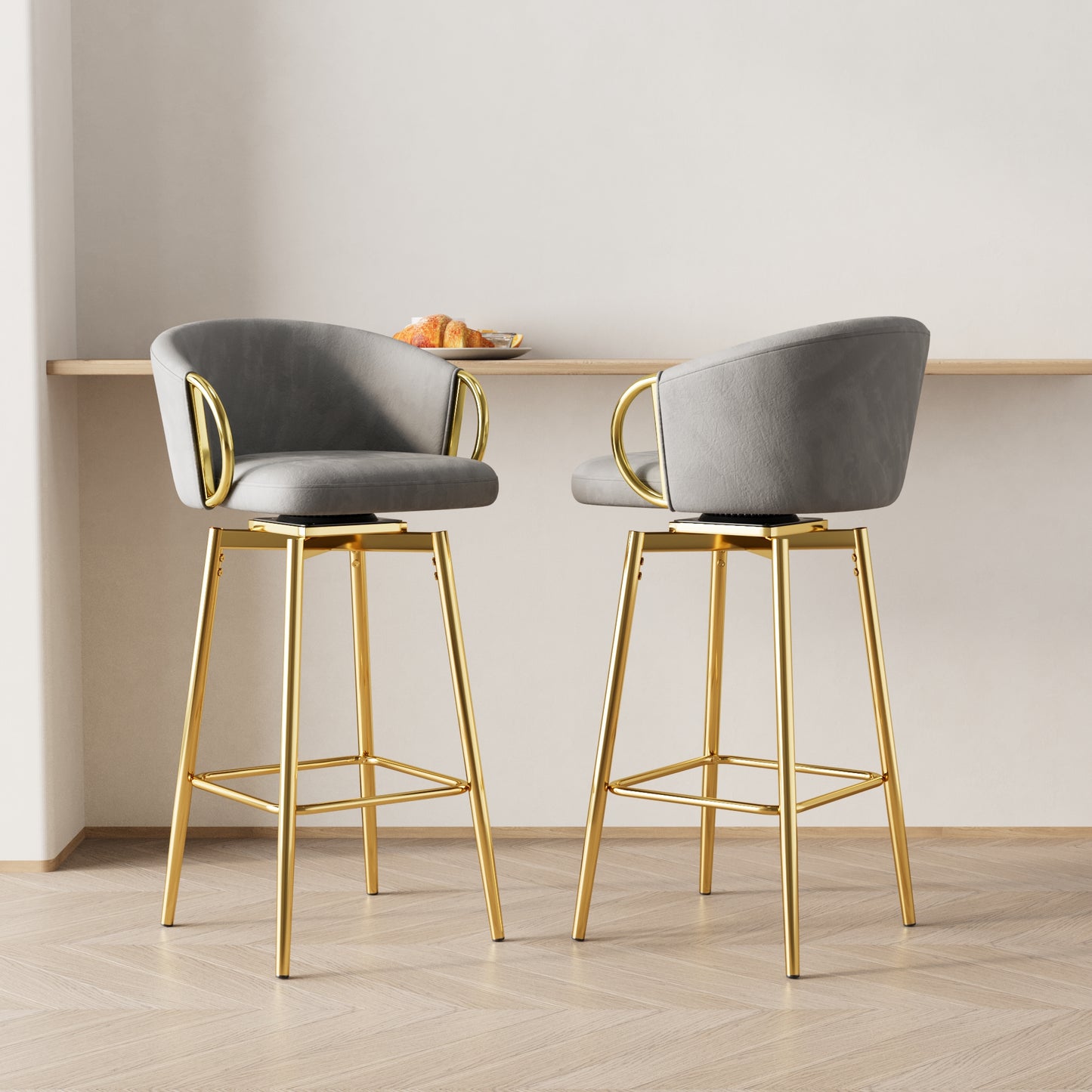 Grey swivel bar stool with gold legs and armrests