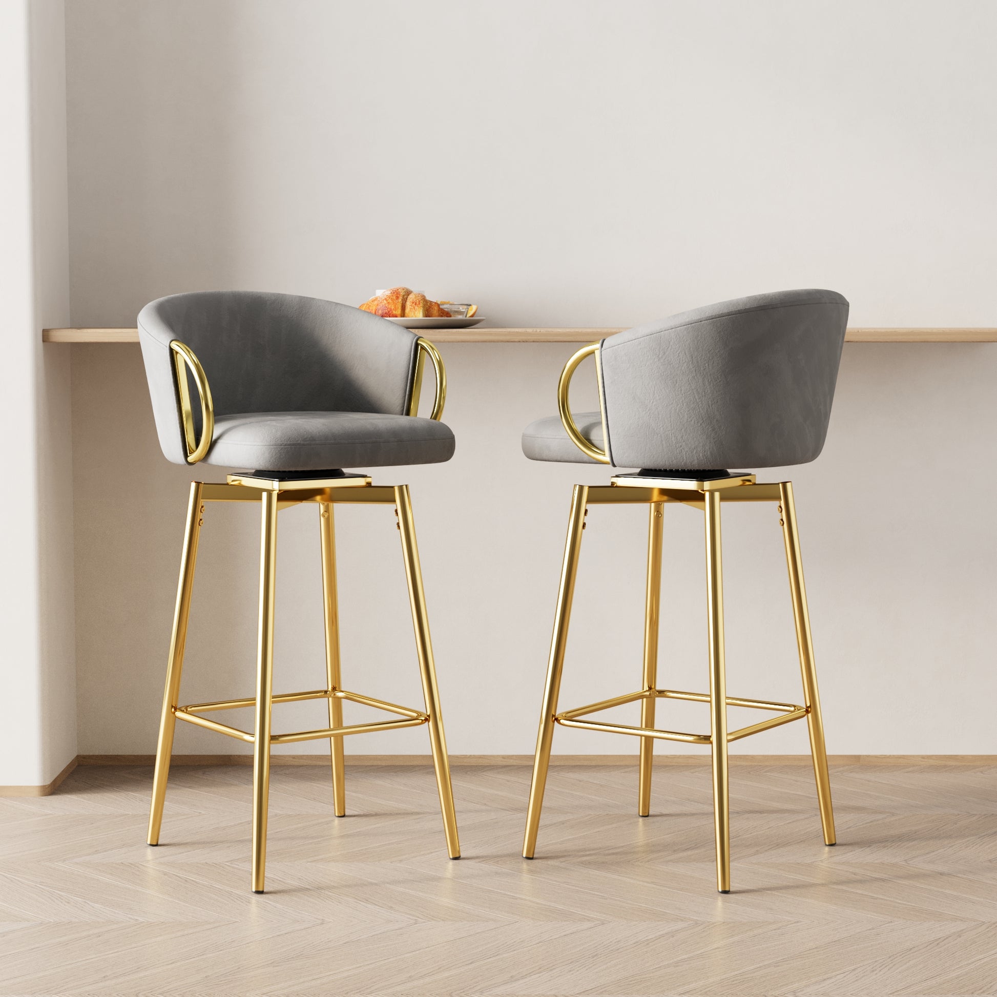 Grey swivel bar stool with gold legs and armrests