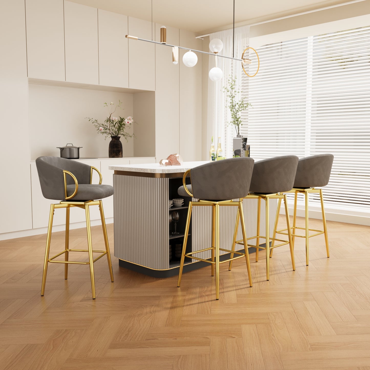 Four grey velvet bar stools with gold legs swivel around a modern kitchen island