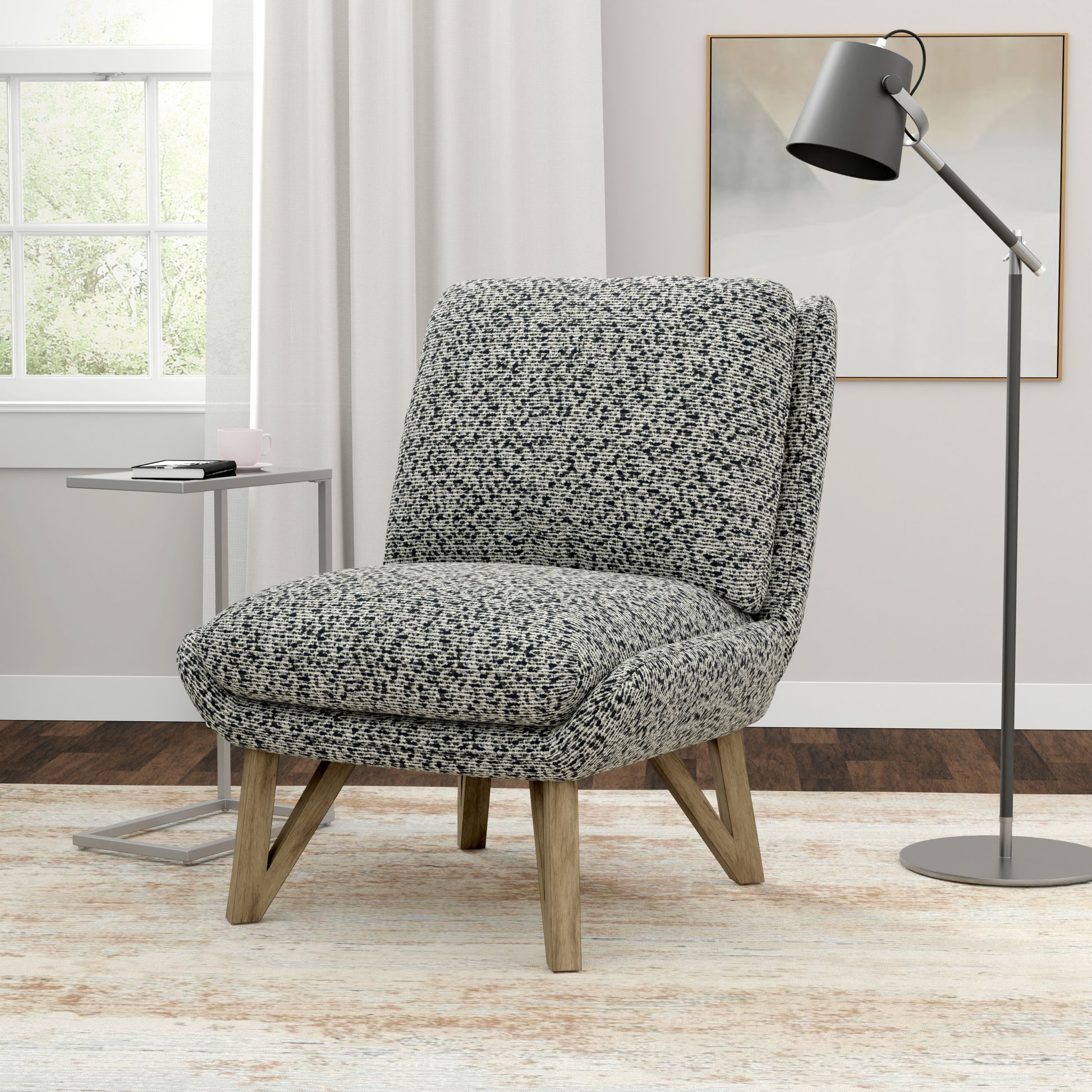 Black and white textured accent chair with wooden legs