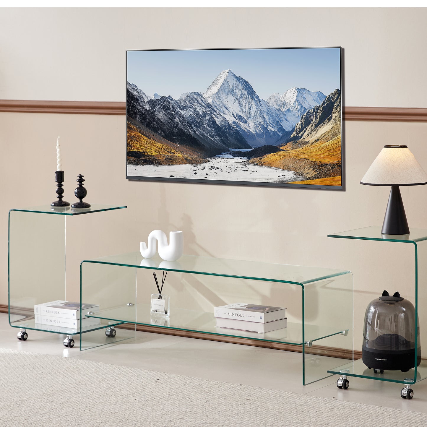 Modern clear glass TV stand with sleek curved edges and caster wheels