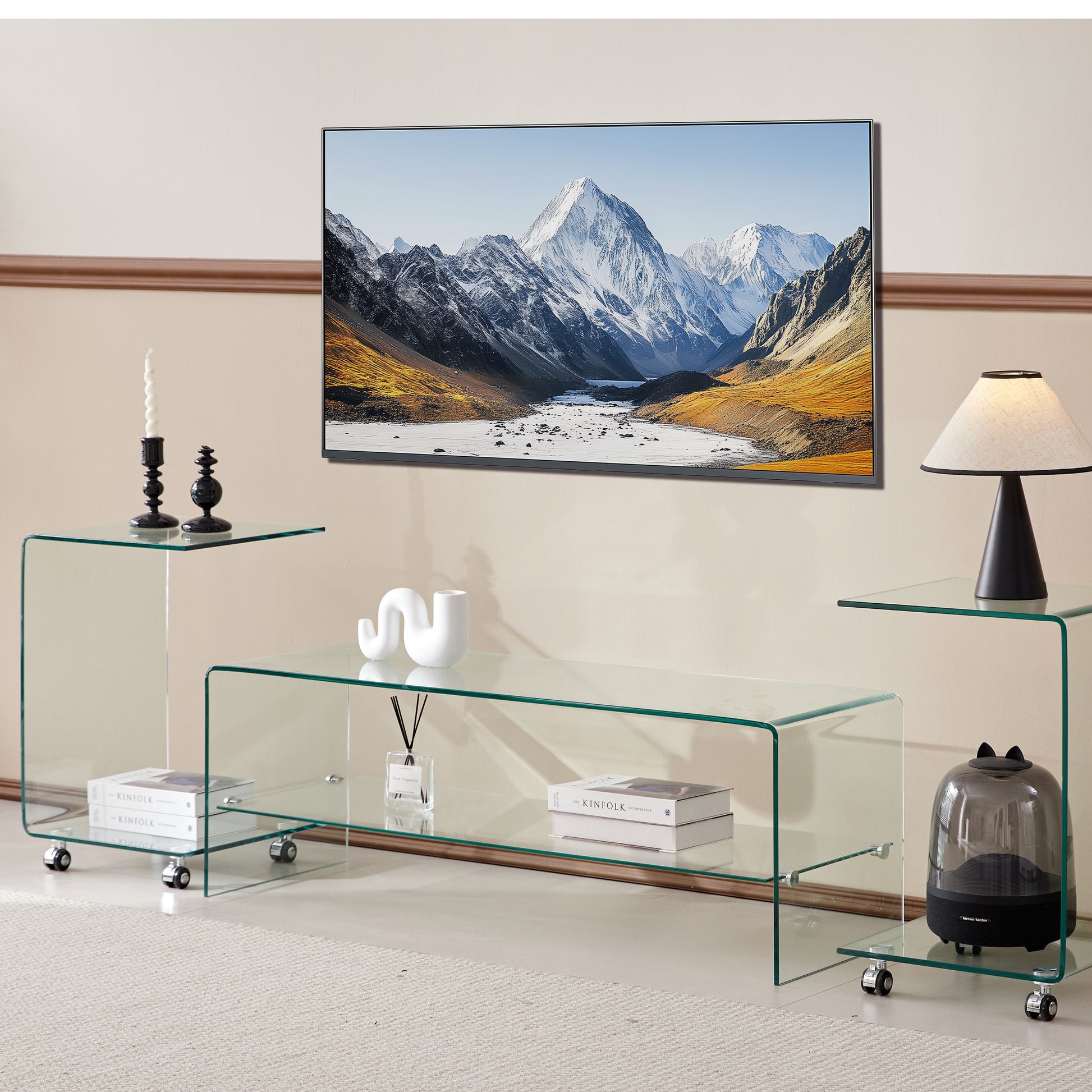 Modern clear glass TV stand with sleek curved edges and caster wheels