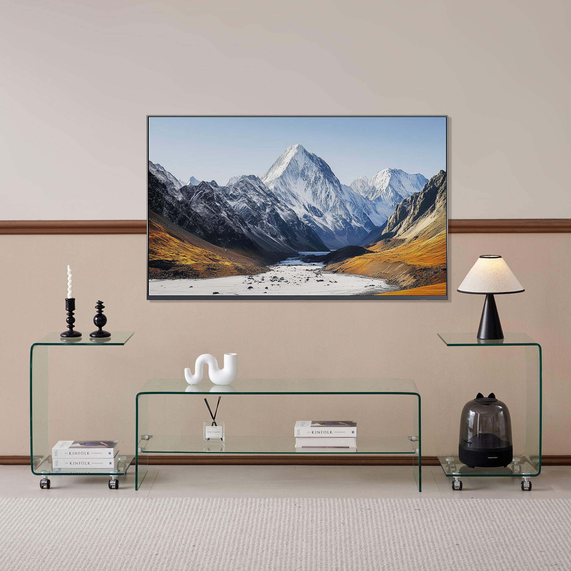 Modern minimalist glass TV stand with curved edges and chrome casters