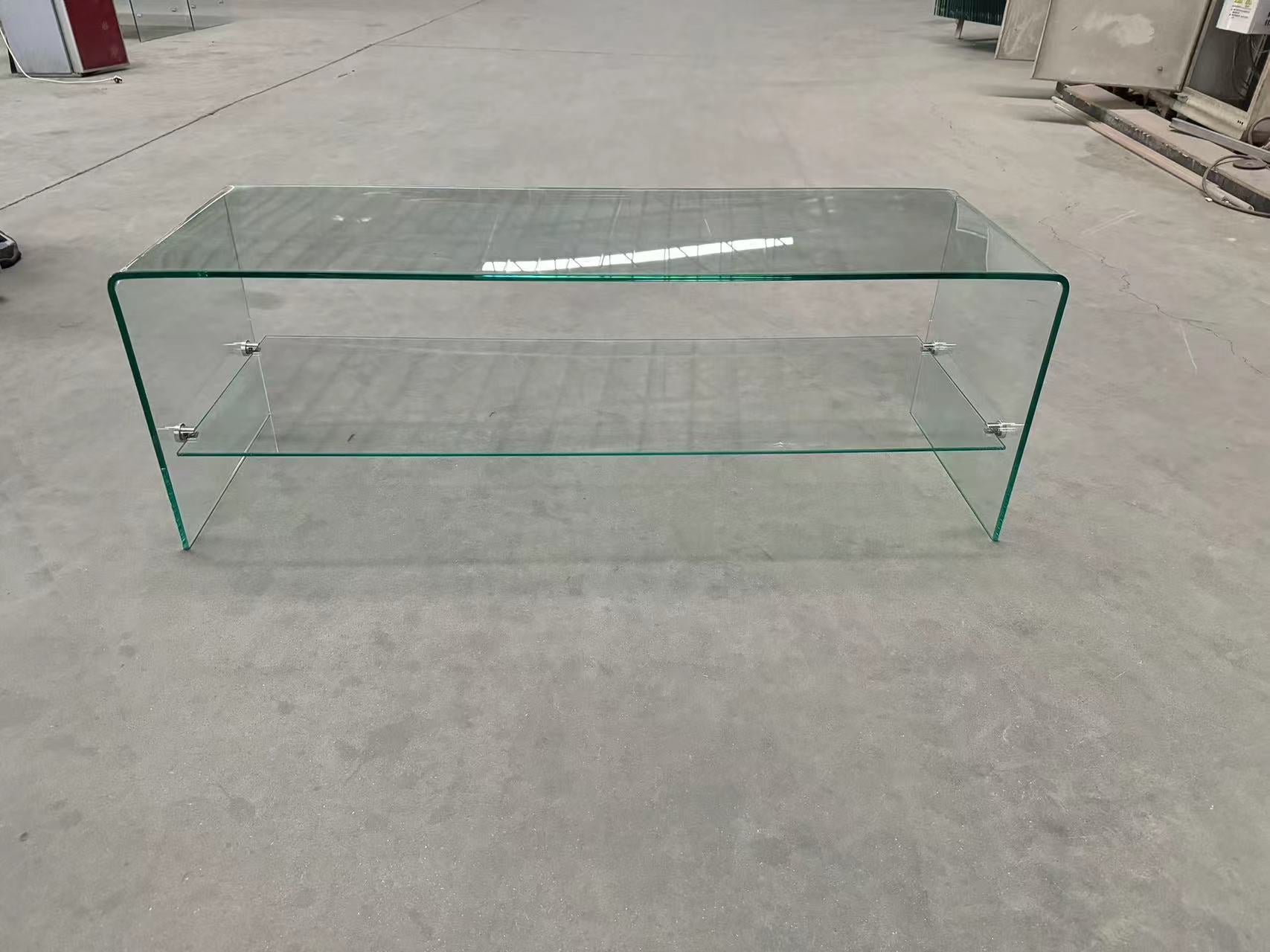 Curved glass coffee table with two shelves and chrome accents