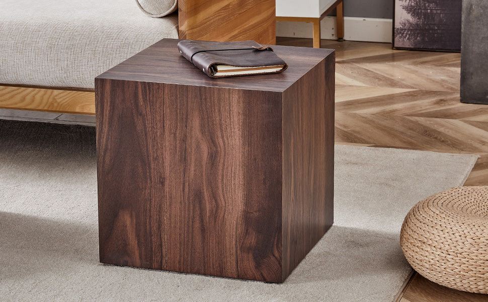 Modern dark wood cube side table with a leatherbound notebook