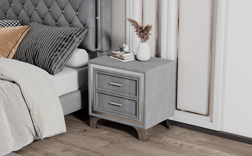 Grey velvet nightstand with two drawers and silver accents