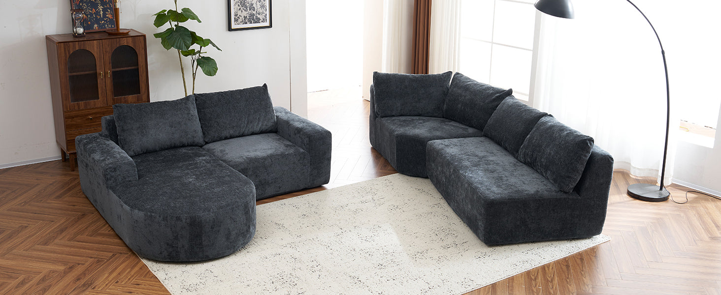 Dark grey plush sectional sofa with rounded chaise