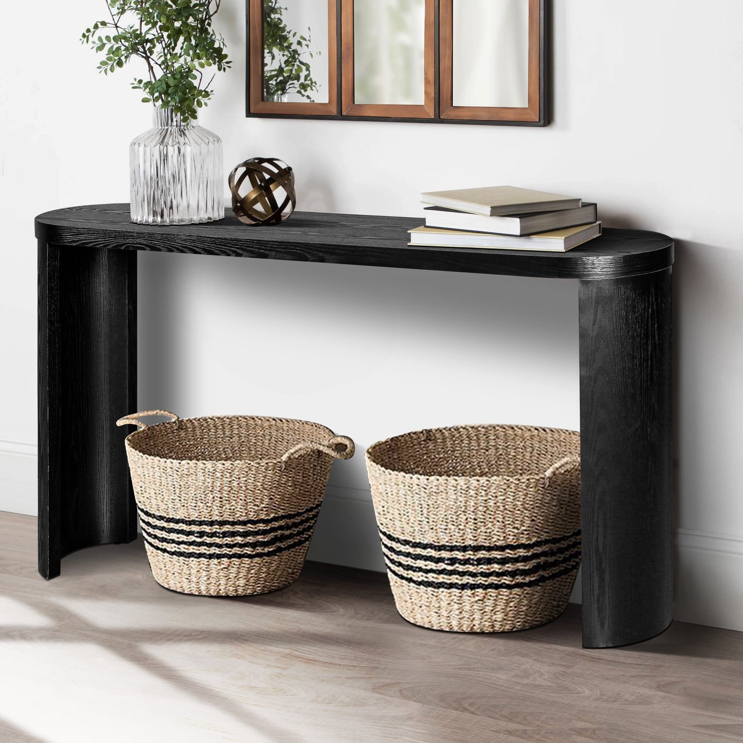 Modern black wood waterfall console table with two striped seagrass baskets