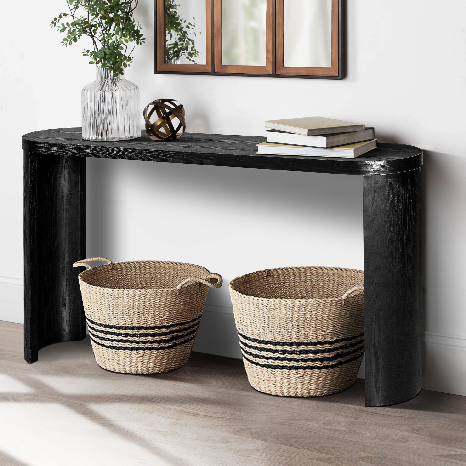 Modern black wood waterfall console table with two striped seagrass baskets
