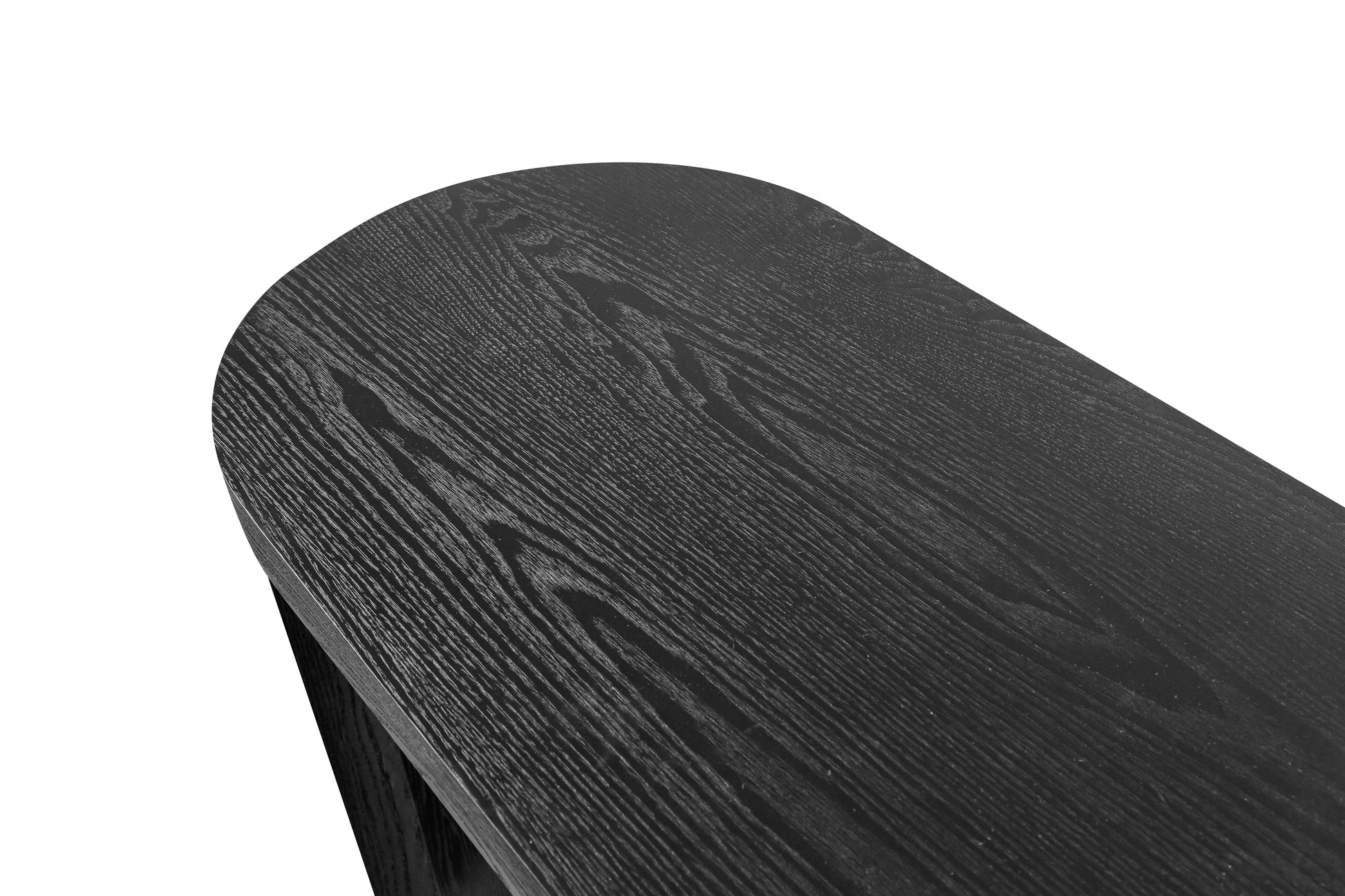 Closeup of a rounded edge of a dark wood dining table