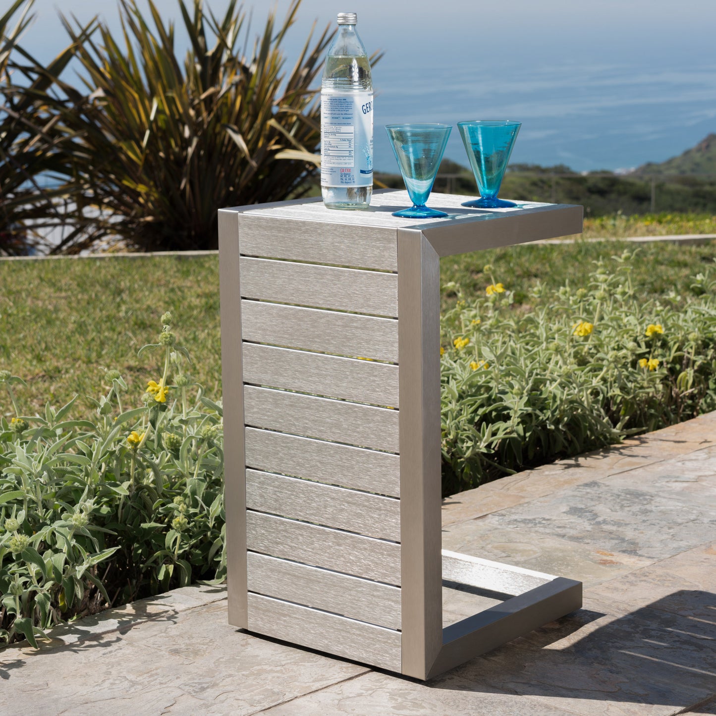 Modern outdoor side table with slatted grey composite and brushed aluminum frame