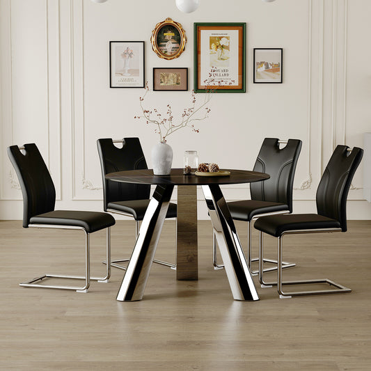 Black leather dining chairs with chrome legs surrounding a round black table