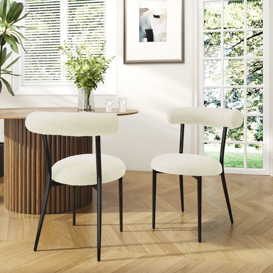 Cream boucle dining chairs with black metal legs