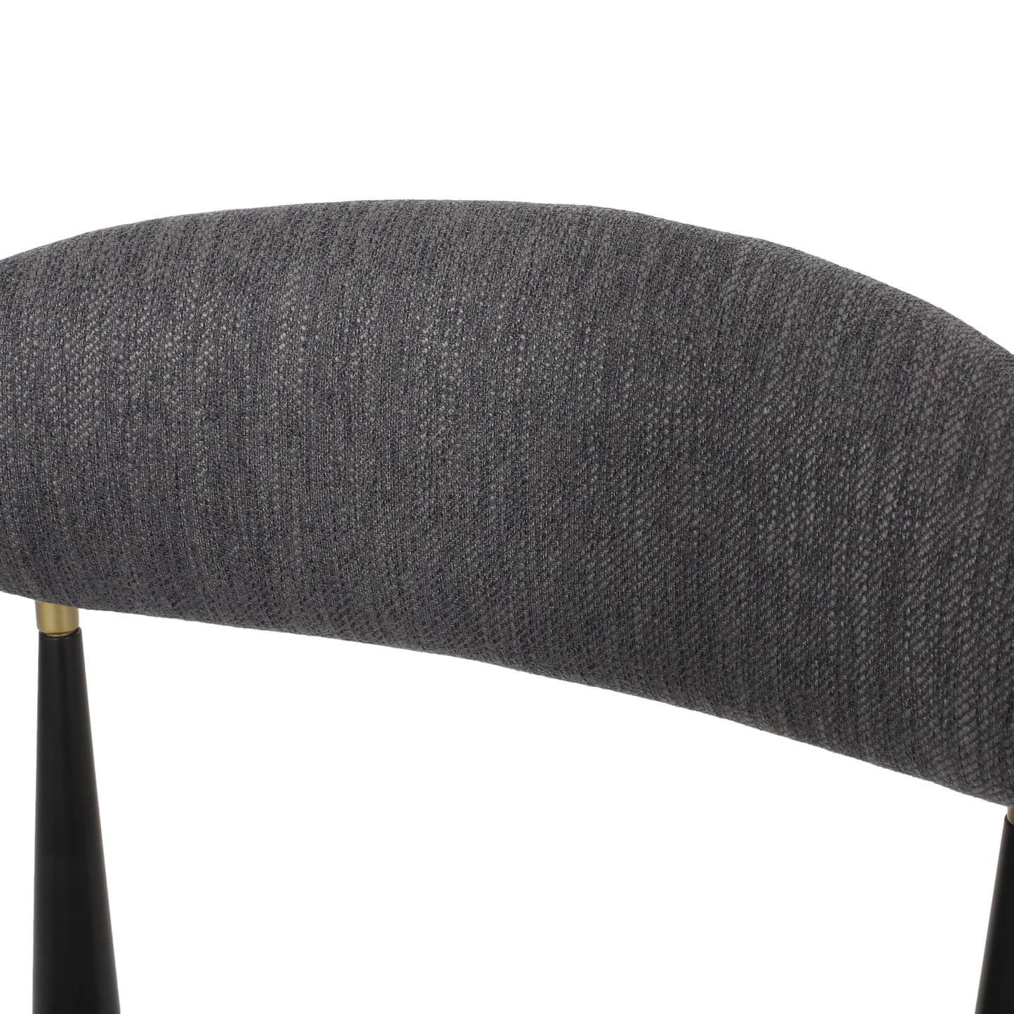 Closeup of curved charcoal grey textured fabric seat back with gold accents and black leg