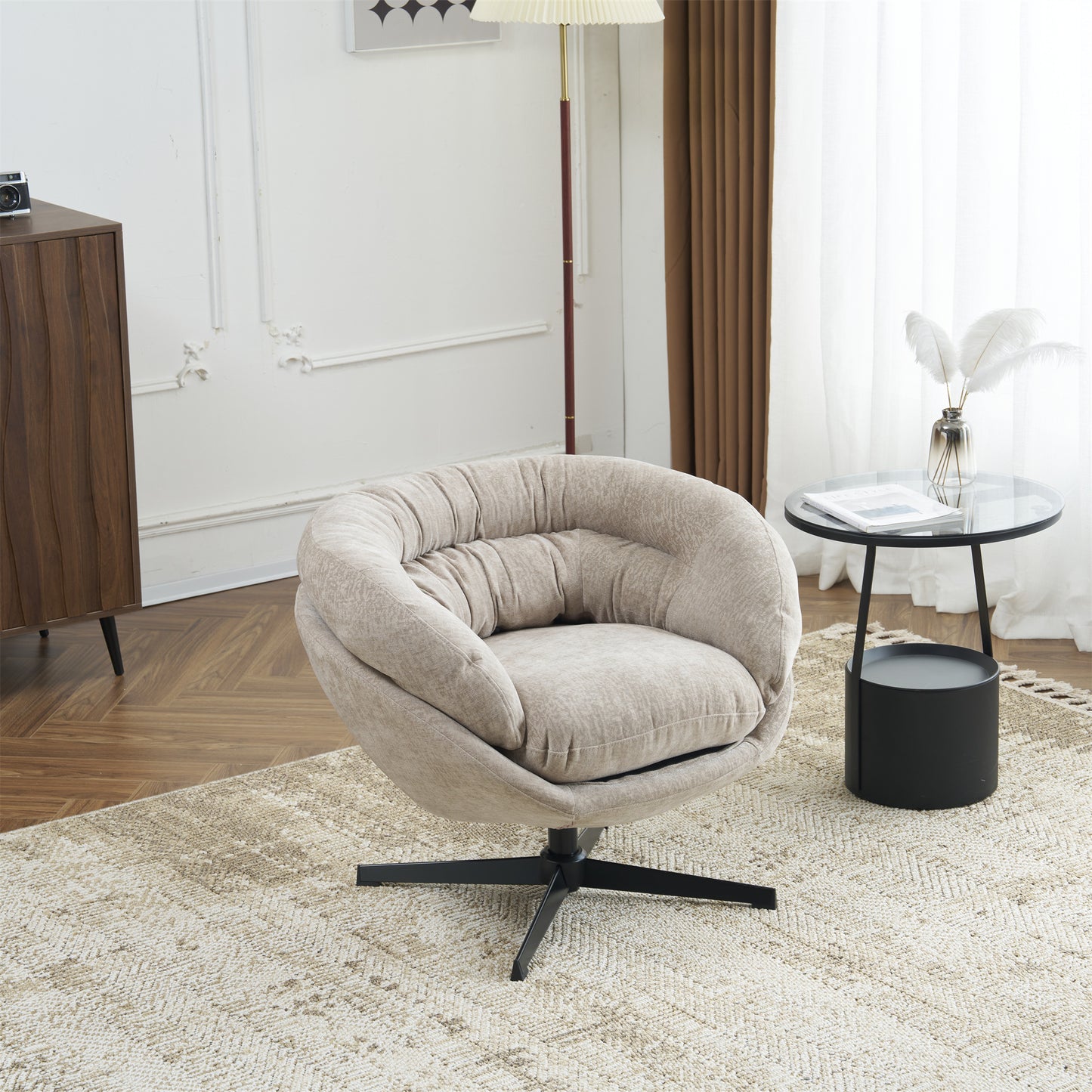 Plush beige accent chair with tufted details and black swivel base