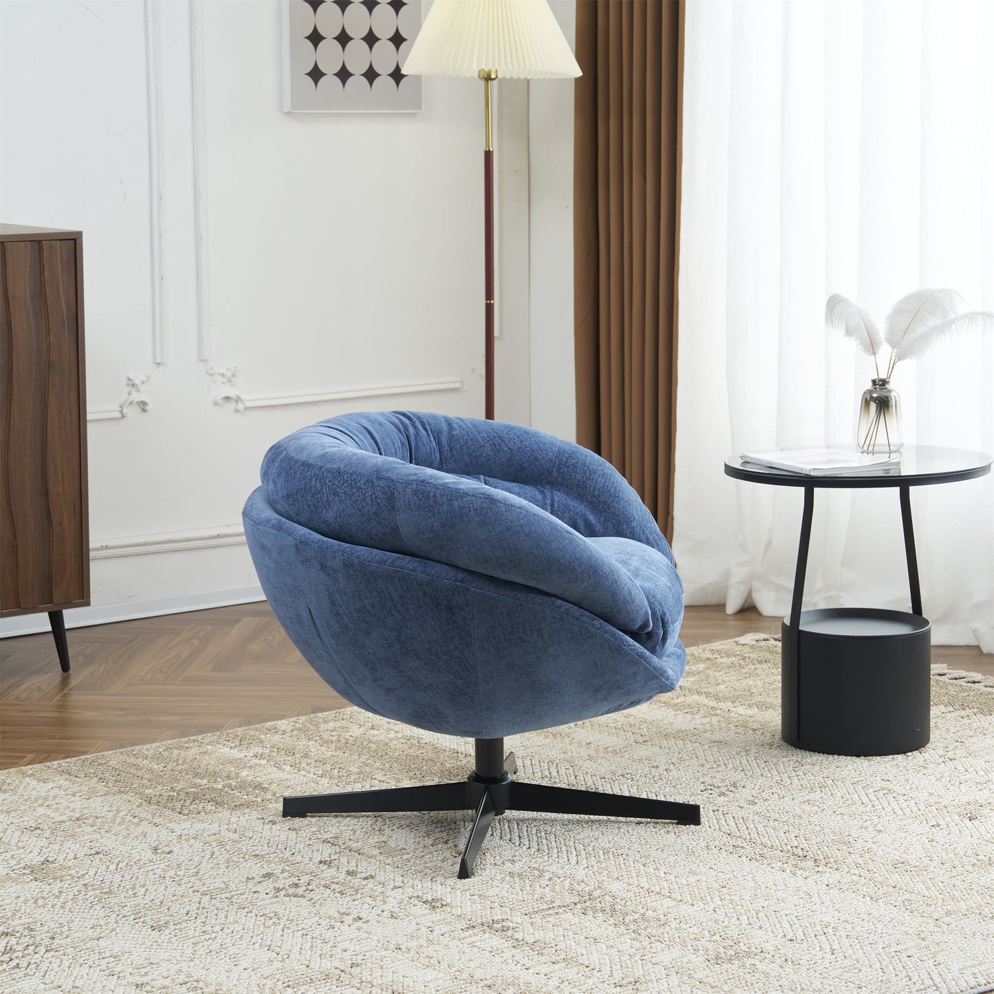 Plush blue velvet accent chair with swiveling base