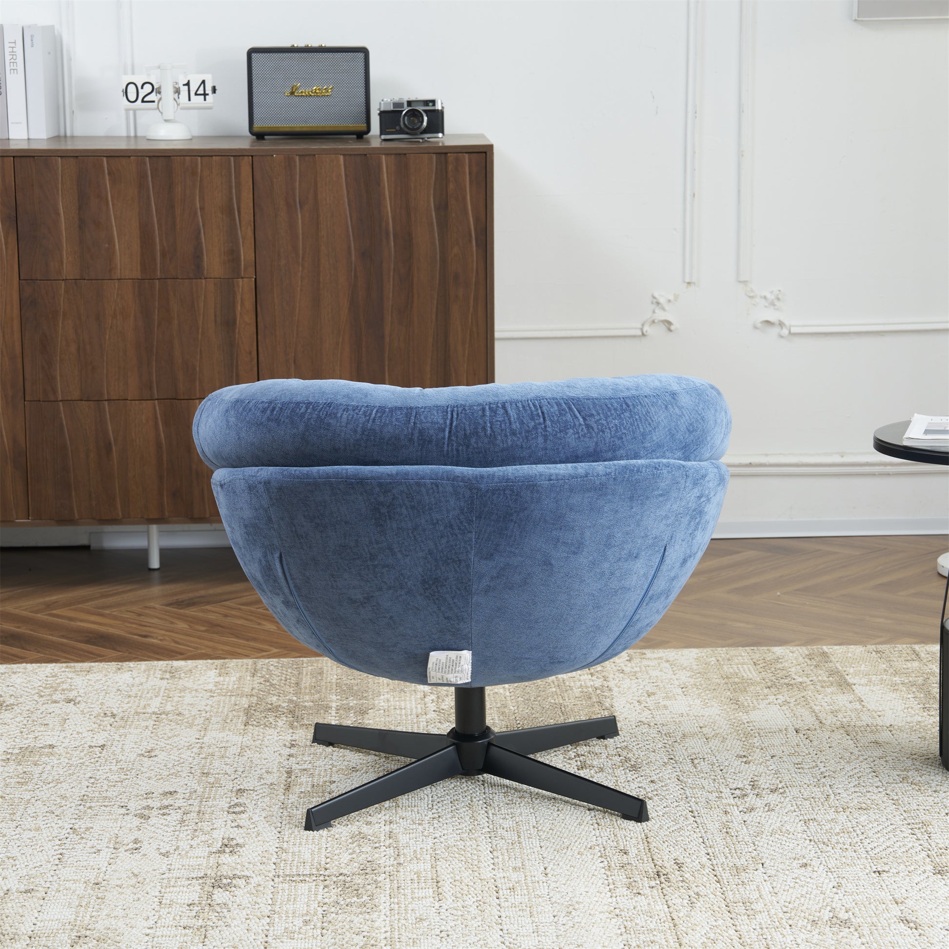 Blue velvet swivel accent chair with modern design