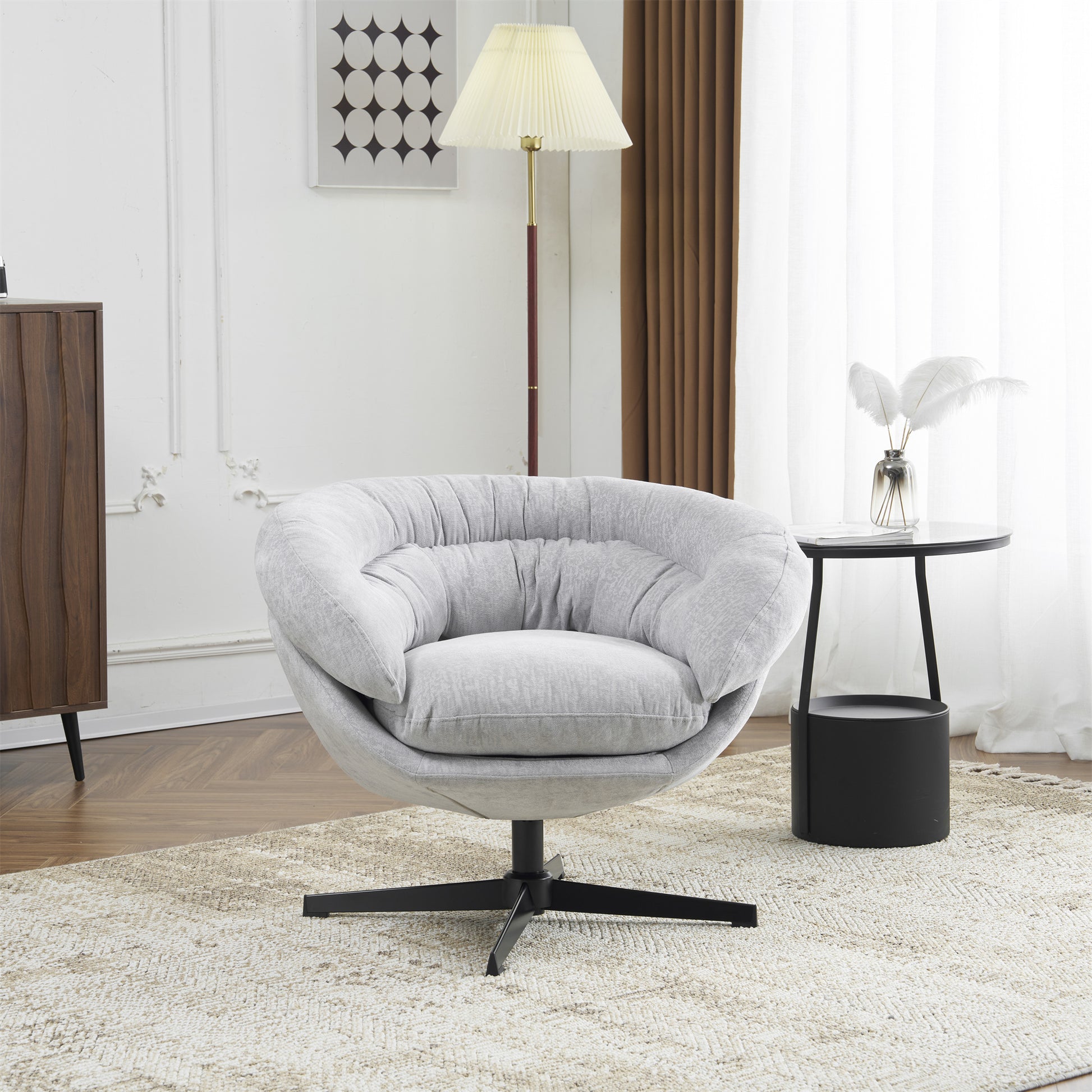 Light grey fabric armchair with tufted cushions