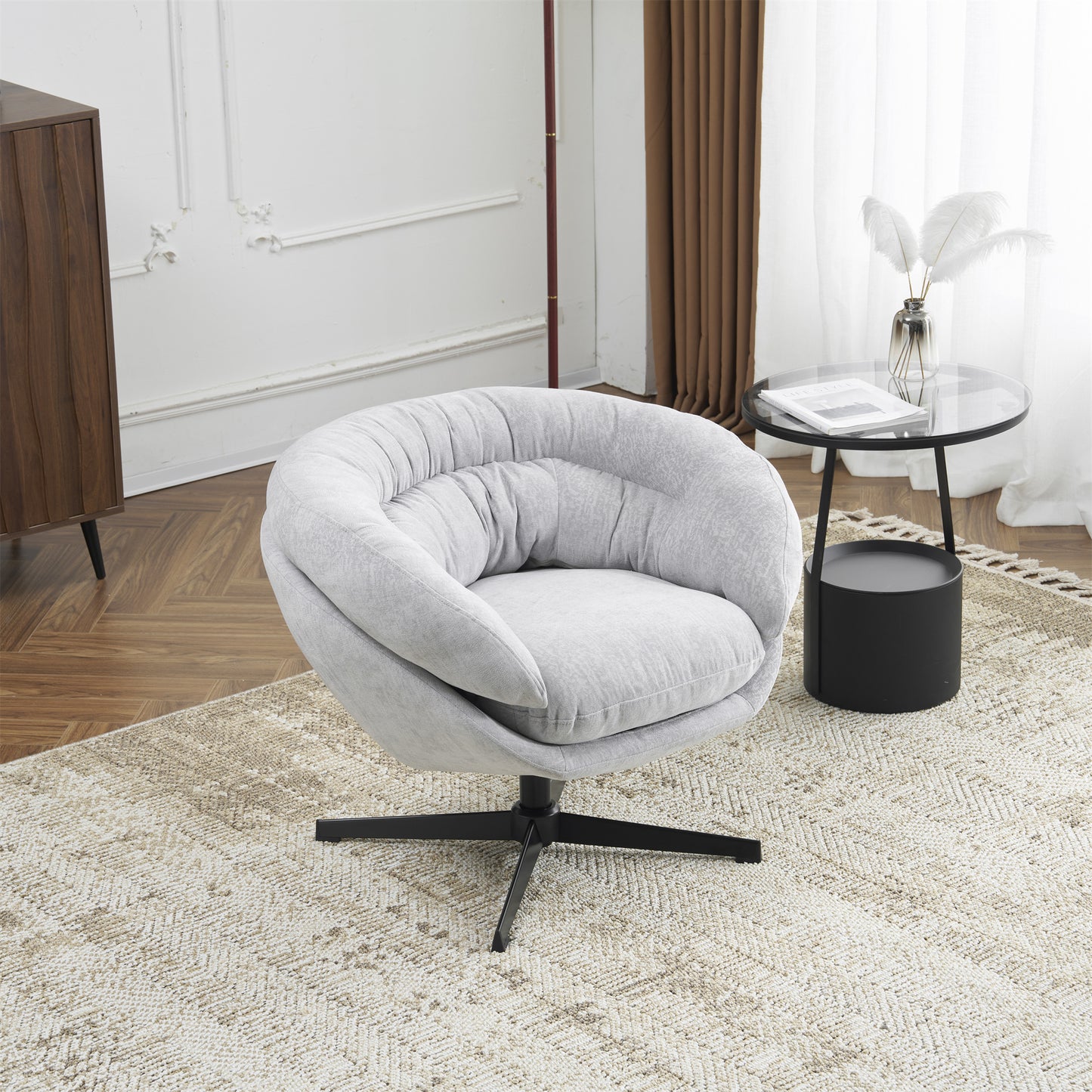 Plush light gray swivel accent chair with channel tufting and black metal base