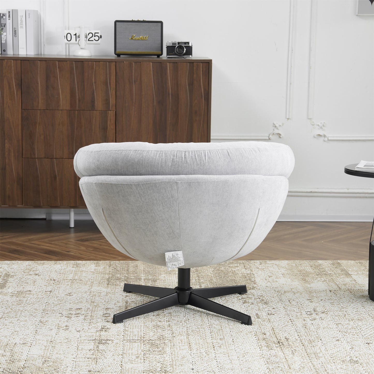 Light gray fabric accent chair with plush rounded seat and swiveling base