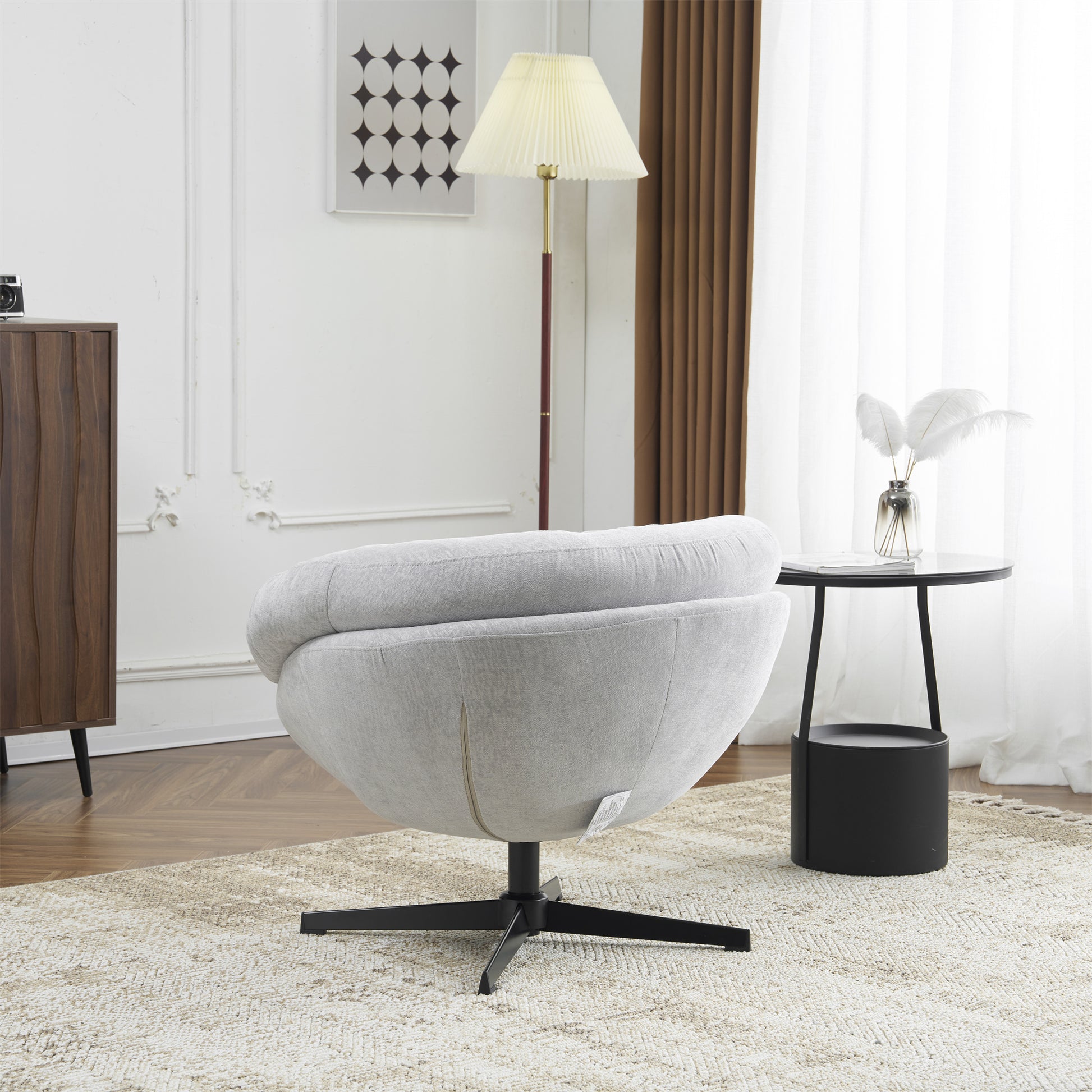Light grey textured fabric accent chair with a swivel base for modern living rooms
