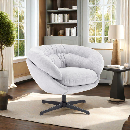 Plush white accent chair with swiveling base and channel tufting