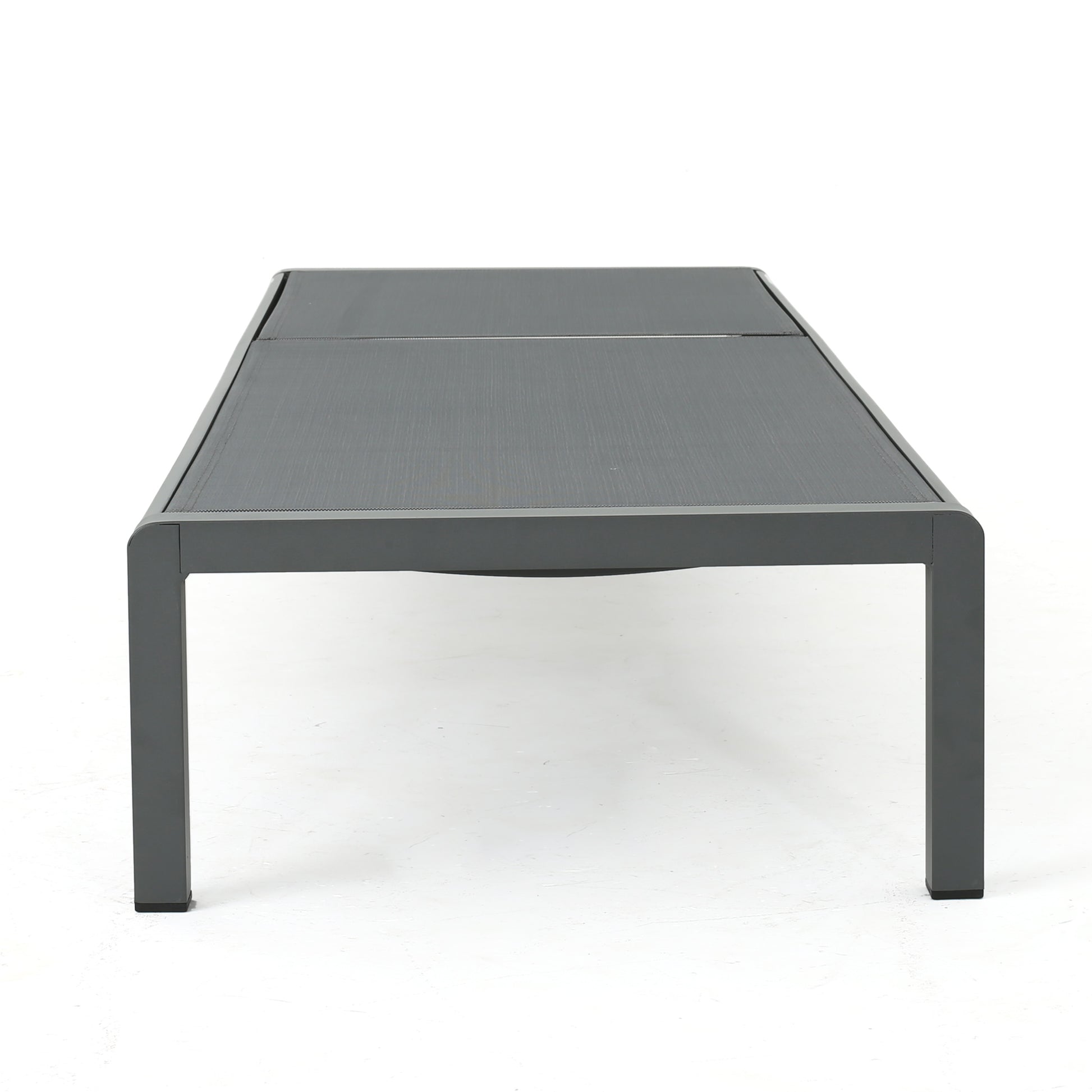 Modern grey outdoor coffee table with sleek aluminum frame and woven fabric top