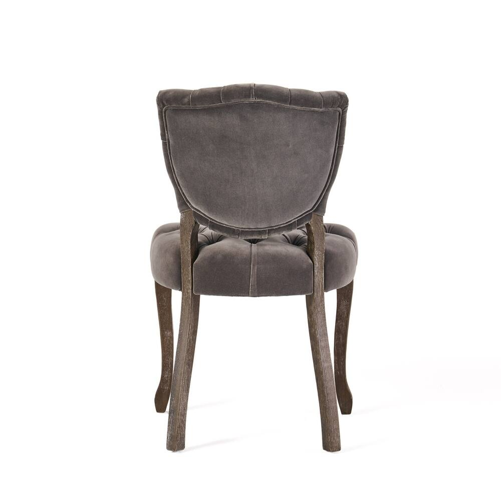 Tufted grey velvet accent chair with distressed wood legs