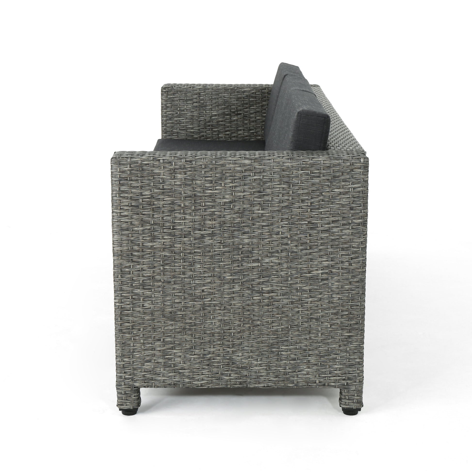 Gray rattan sectional sofa with dark gray cushions