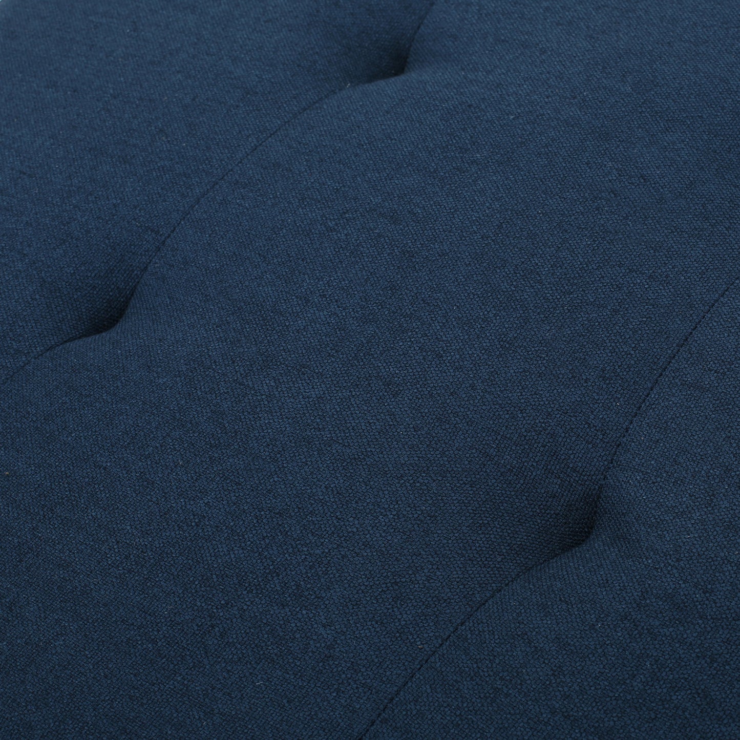 Navy blue textured fabric upholstery with tufted details