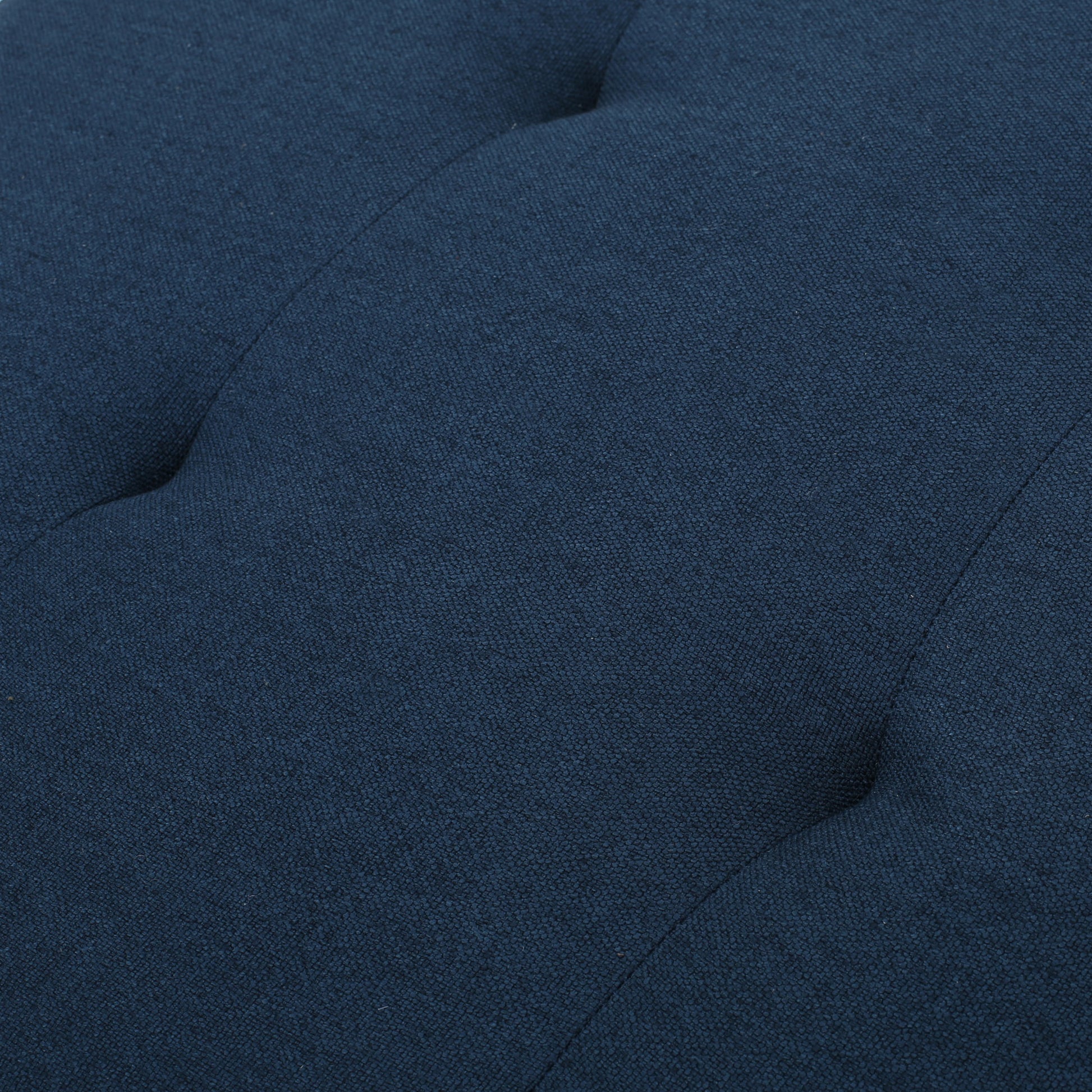 Navy blue textured fabric upholstery with tufted details