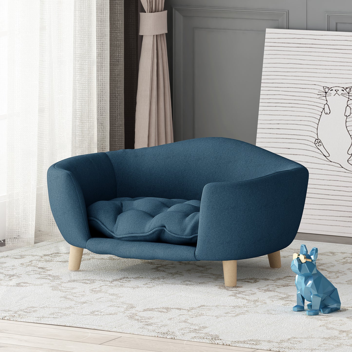 Deep blue tufted dog bed with light wood legs and a plush cushion