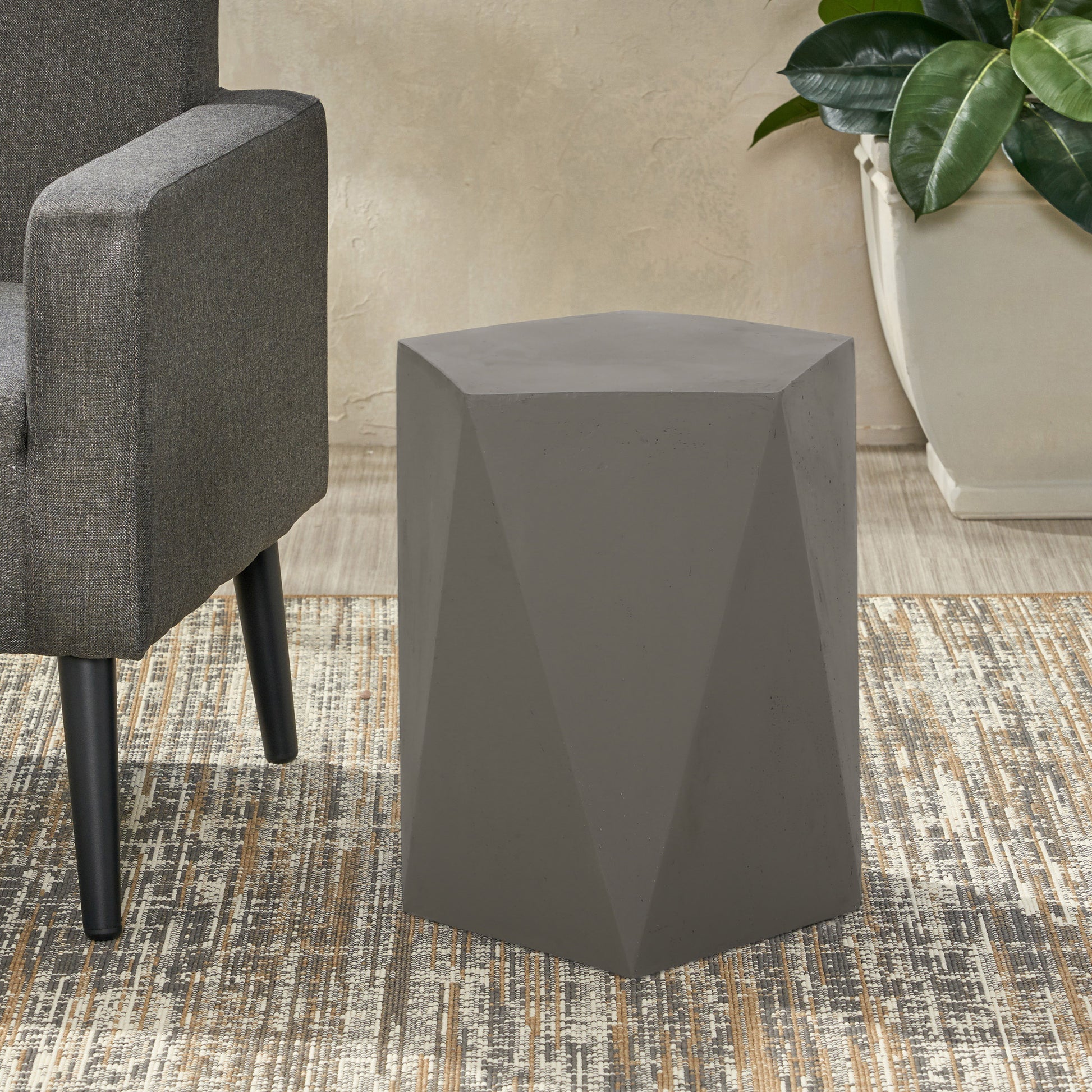 Geometric concrete accent table with faceted design