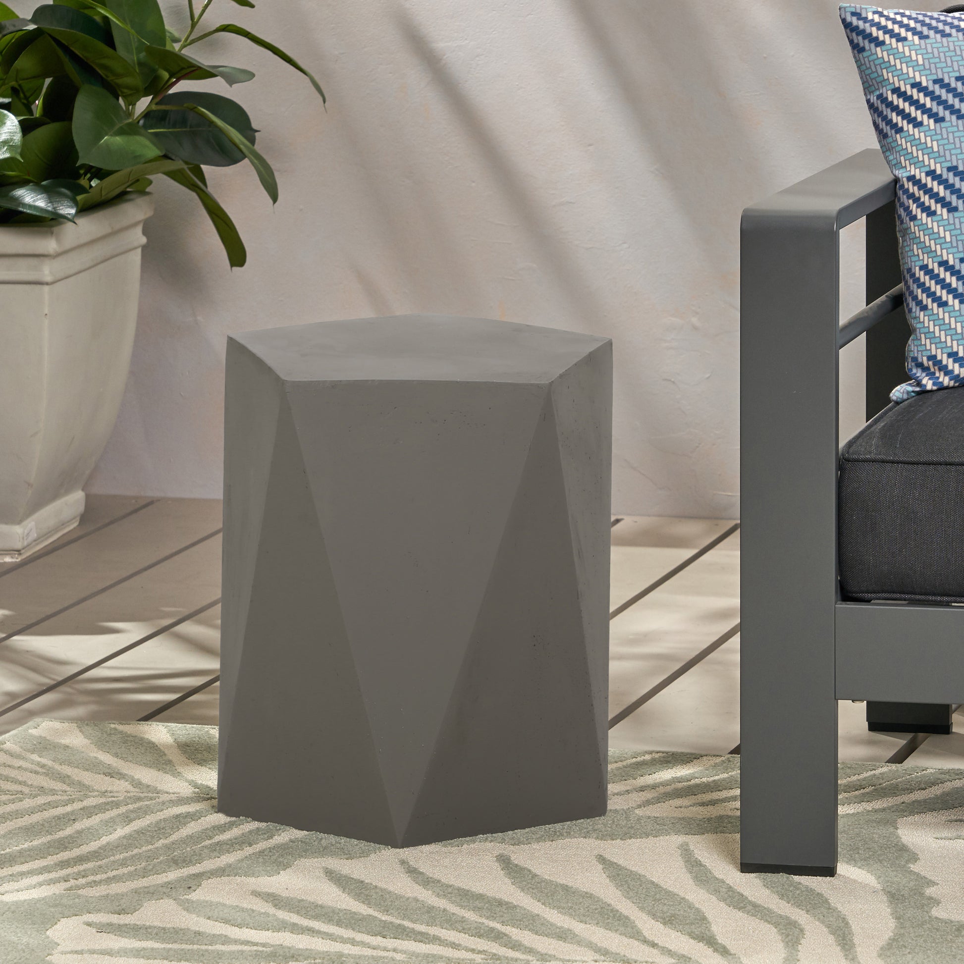 Modern grey concrete geometric accent table for patio use